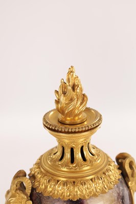 Lot 834 - A FINE PAIR OF LATE GEORGE III ORMOLU AND BLUE JOHN MANTEL URNS/CANDLE HOLDERS ON VEINED PINK MARBLE PEDESTAL BASES ATTRIBUTED TO MATTHEW BOULTON