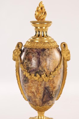 Lot 834 - A FINE PAIR OF LATE GEORGE III ORMOLU AND BLUE JOHN MANTEL URNS/CANDLE HOLDERS ON VEINED PINK MARBLE PEDESTAL BASES ATTRIBUTED TO MATTHEW BOULTON