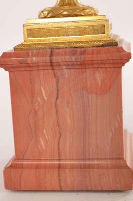 Lot 834 - A FINE PAIR OF LATE GEORGE III ORMOLU AND BLUE JOHN MANTEL URNS/CANDLE HOLDERS ON VEINED PINK MARBLE PEDESTAL BASES ATTRIBUTED TO MATTHEW BOULTON