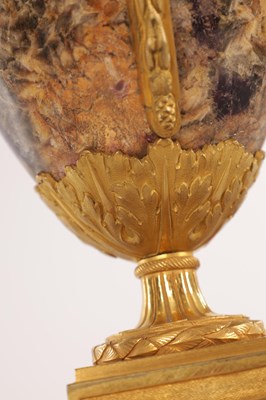 Lot 834 - A FINE PAIR OF LATE GEORGE III ORMOLU AND BLUE JOHN MANTEL URNS/CANDLE HOLDERS ON VEINED PINK MARBLE PEDESTAL BASES ATTRIBUTED TO MATTHEW BOULTON