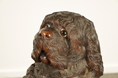 Lot 1141 - A RARE 19TH CENTURY BLACK FOREST CARVED LINDEN WOOD STICK STAND MODELLED AS A BEGGING DOG