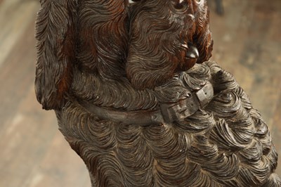 Lot 1141 - A RARE 19TH CENTURY BLACK FOREST CARVED LINDEN WOOD STICK STAND MODELLED AS A BEGGING DOG
