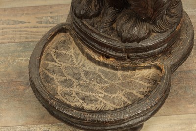 Lot 1141 - A RARE 19TH CENTURY BLACK FOREST CARVED LINDEN WOOD STICK STAND MODELLED AS A BEGGING DOG