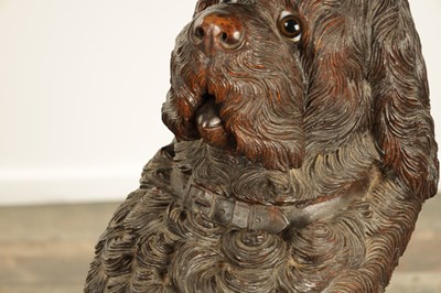 Lot 1141 - A RARE 19TH CENTURY BLACK FOREST CARVED LINDEN WOOD STICK STAND MODELLED AS A BEGGING DOG
