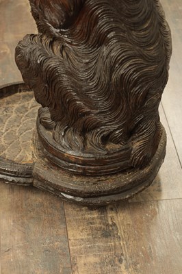 Lot 1141 - A RARE 19TH CENTURY BLACK FOREST CARVED LINDEN WOOD STICK STAND MODELLED AS A BEGGING DOG