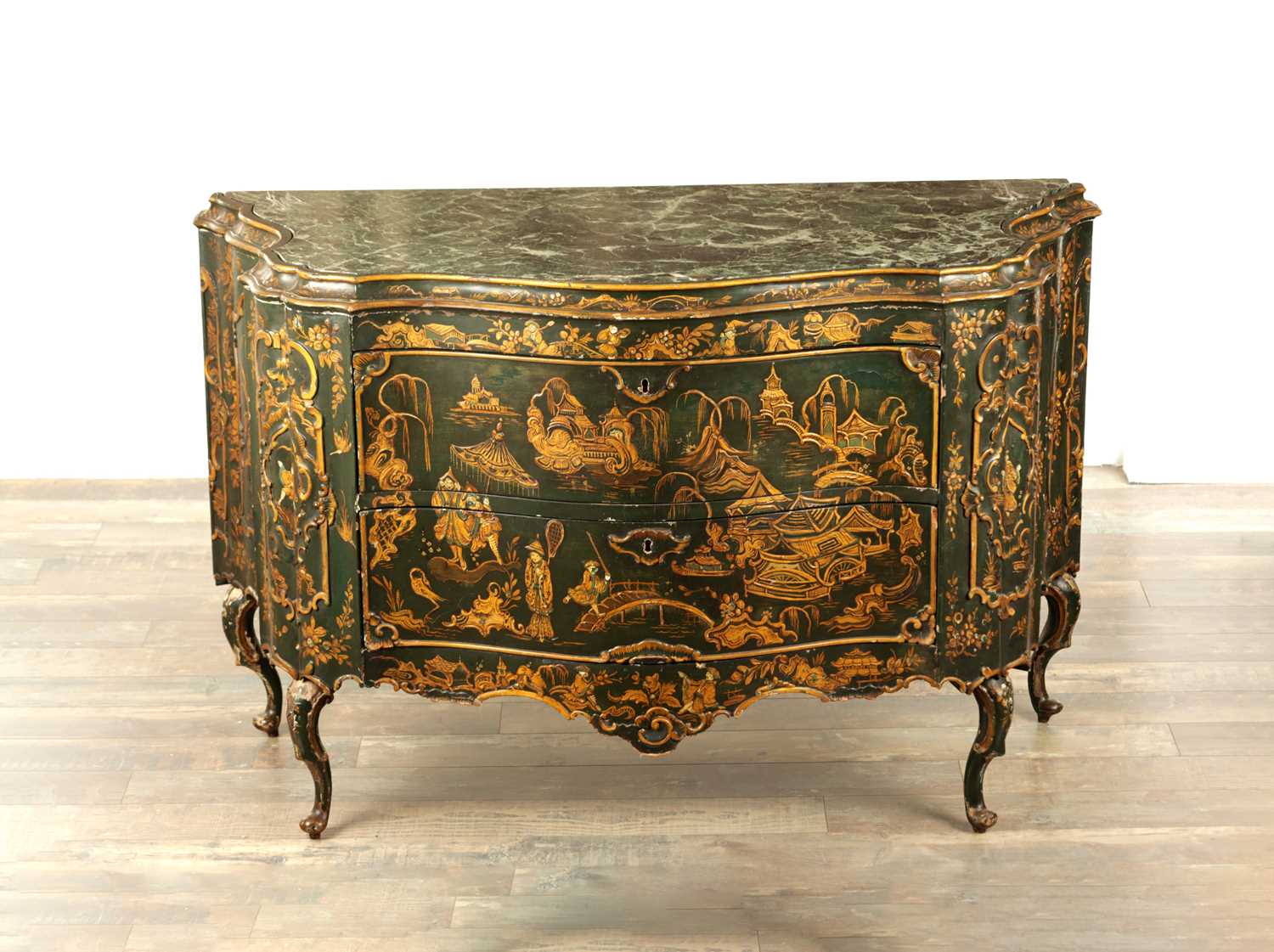Lot 1239 - A 19TH CENTURY ITALIAN CHINOISERIE LACQUERED SERPENTINE SHAPED COMMODE