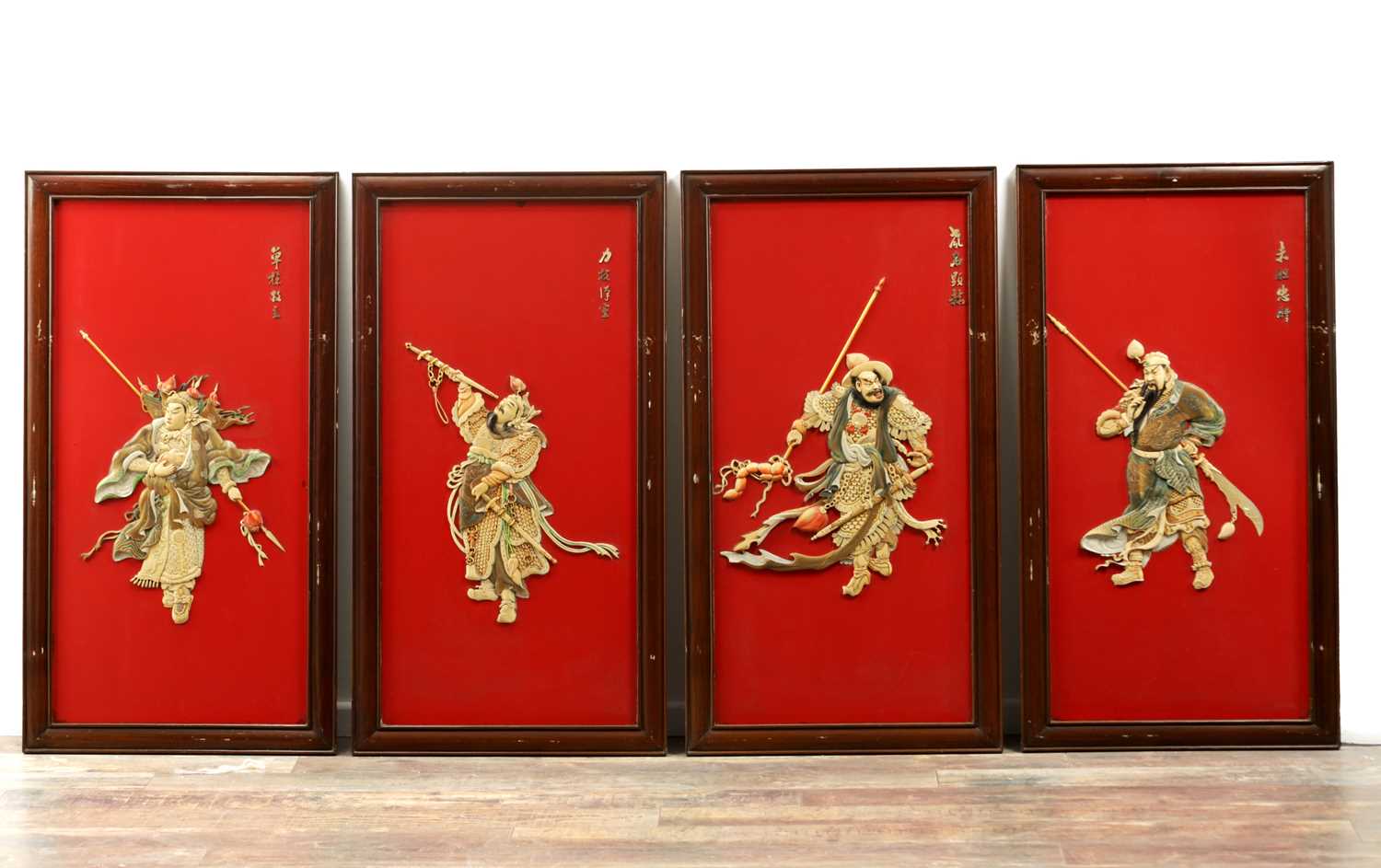 Lot 204 - A SET OF FOUR LATE 19TH CENTURY CHINESE LACQUERED PANELS WITH IVORY AND MOTHER OF PEARL INLAID FIGURES OF WARRIORS