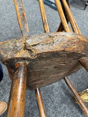 Lot 1216 - A GOOD EARLY 18TH CENTURY ELM PRIMITIVE WELSH STICK BACK CHAIR