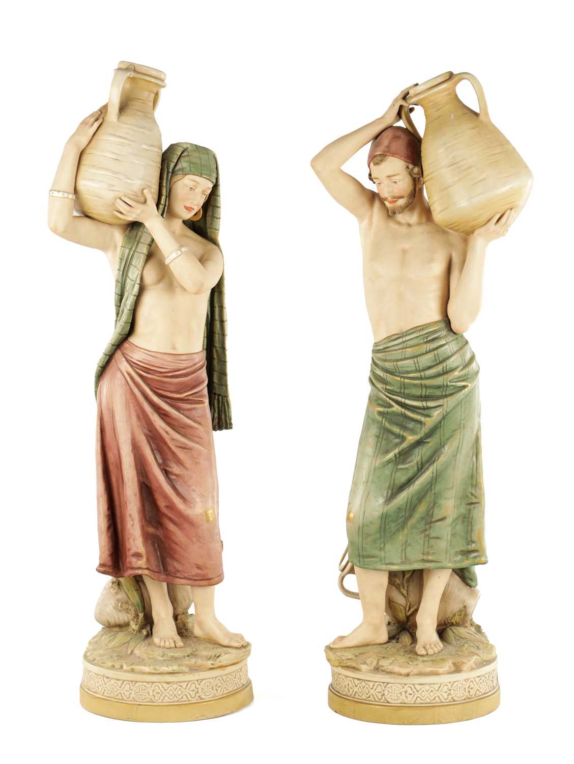 Lot 40 - A LARGE PAIR OF ROYAL DUX PORCELAIN FIGURES OF WATER CARRIERS