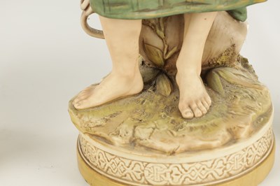 Lot 40 - A LARGE PAIR OF ROYAL DUX PORCELAIN FIGURES OF WATER CARRIERS