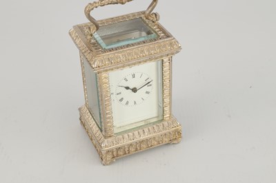 Lot 1471 - A 20TH CENTURY CAST SOLID SILVER CARRIAGE CLOCK