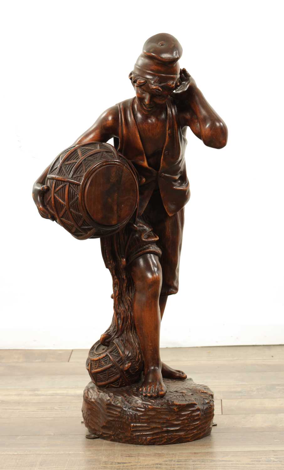 Lot 1109 - A 19TH CENTURY CONTINENTAL CARVED WOOD FIGURE OF BLACK FOREST TYPE