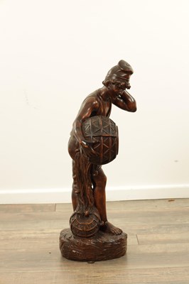 Lot 1109 - A 19TH CENTURY CONTINENTAL CARVED WOOD FIGURE OF BLACK FOREST TYPE