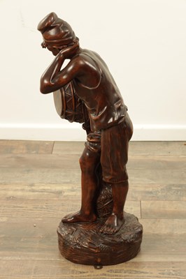 Lot 1109 - A 19TH CENTURY CONTINENTAL CARVED WOOD FIGURE OF BLACK FOREST TYPE
