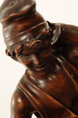 Lot 1109 - A 19TH CENTURY CONTINENTAL CARVED WOOD FIGURE OF BLACK FOREST TYPE