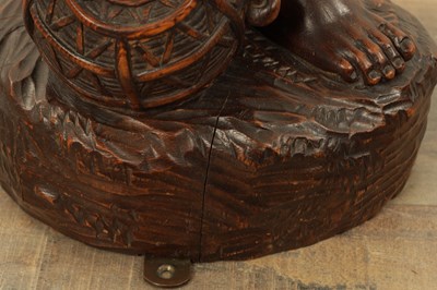 Lot 1109 - A 19TH CENTURY CONTINENTAL CARVED WOOD FIGURE OF BLACK FOREST TYPE