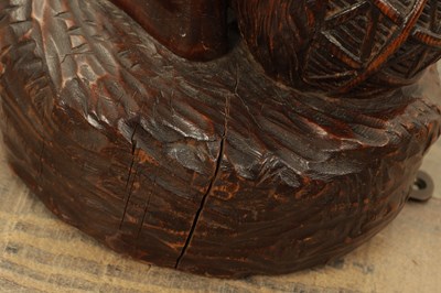 Lot 1109 - A 19TH CENTURY CONTINENTAL CARVED WOOD FIGURE OF BLACK FOREST TYPE