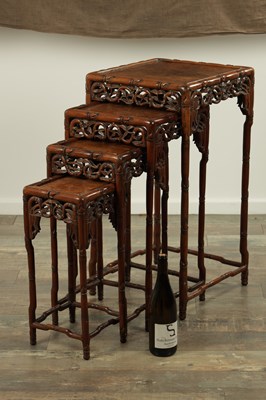 Lot 332 - A GOOD SET OF FOUR 19TH CENTURY CHINESE NEST OF TABLES