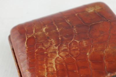 Lot 1409 - AN EARLY 20TH CENTURY CROCODILE SKIN ASPREY TRAVELING ALARM CLOCK