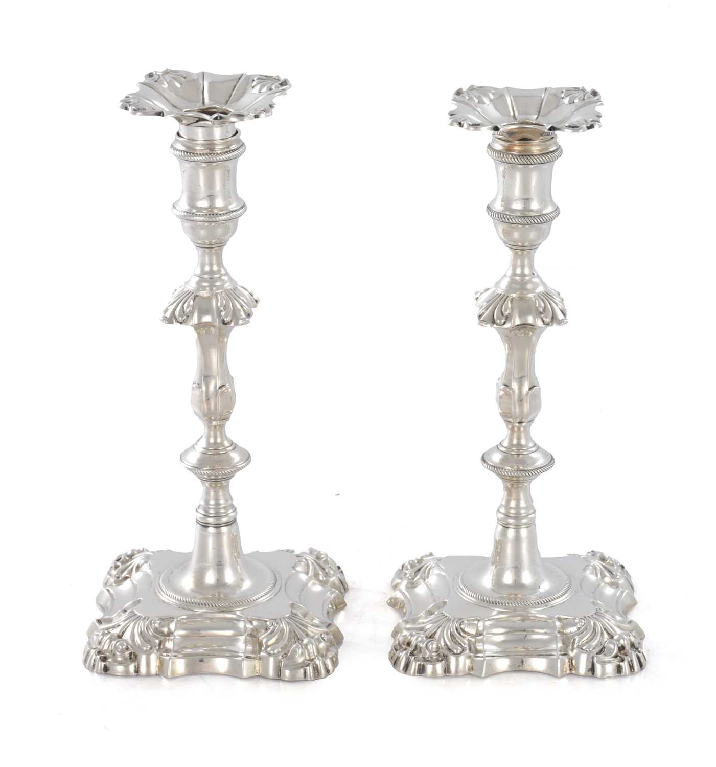 Lot 226 - A PAIR OF GEORGE III CAST SILVER CANDLESTICKS
