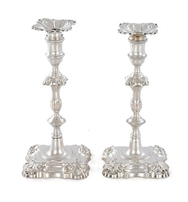 Lot 226 - A PAIR OF GEORGE III CAST SILVER CANDLESTICKS
