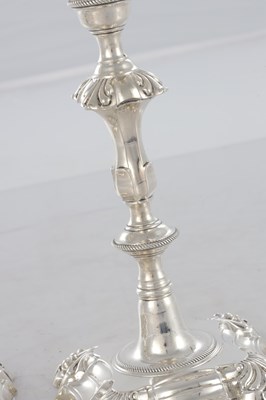 Lot 226 - A PAIR OF GEORGE III CAST SILVER CANDLESTICKS