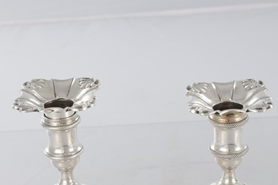 Lot 226 - A PAIR OF GEORGE III CAST SILVER CANDLESTICKS