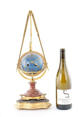 Lot 1444 - A 19TH CENTURY FRENCH ORMOLU AND ROUGE MARBLE MYSTERY CLOCK