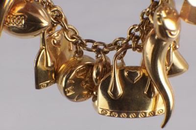 Lot 171 - A 9CT YELLOW GOLD CHARM BRACELET