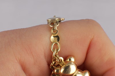 Lot 171 - A 9CT YELLOW GOLD CHARM BRACELET
