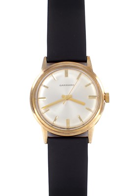 Lot 1317 - A GENTLEMAN’S 9CT YELLOW GOLD GARRARD WRIST WATCH