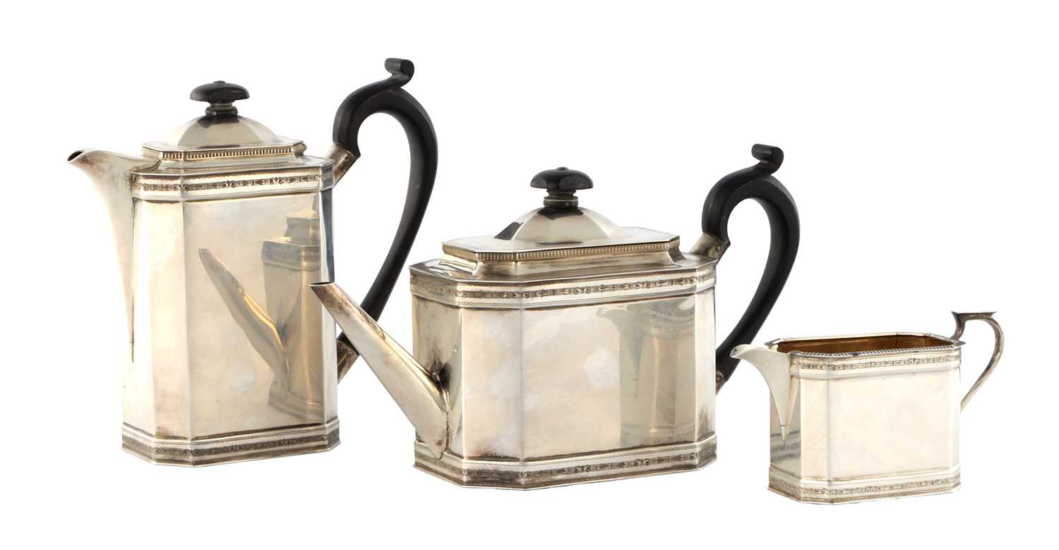 Lot 218 - A GEORGE V SILVER THREE PIECE TEA AND COFEE SERVICE