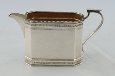 Lot 218 - A GEORGE V SILVER THREE PIECE TEA AND COFEE SERVICE