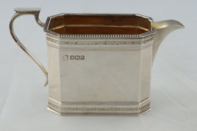 Lot 218 - A GEORGE V SILVER THREE PIECE TEA AND COFEE SERVICE