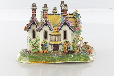 Lot 96 - A 19TH CENTURY STAFFORDSHIRE PORCELAIN "COTTAGE ORNEE" PASTILLE BURNER, AND A LEEDSWARE FLATBACK HOUSE