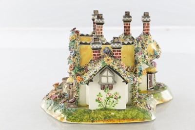 Lot 96 - A 19TH CENTURY STAFFORDSHIRE PORCELAIN "COTTAGE ORNEE" PASTILLE BURNER, AND A LEEDSWARE FLATBACK HOUSE