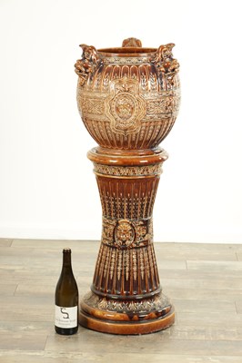 Lot 29 - A 19TH CENTURY TREACLE GLAZED MAJOLICA JARDINIERE ON STAND