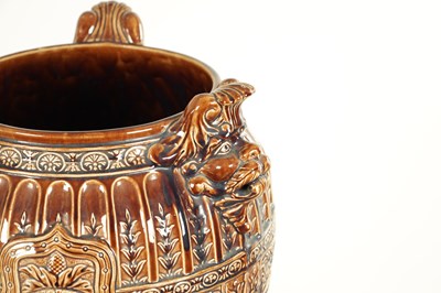Lot 29 - A 19TH CENTURY TREACLE GLAZED MAJOLICA JARDINIERE ON STAND