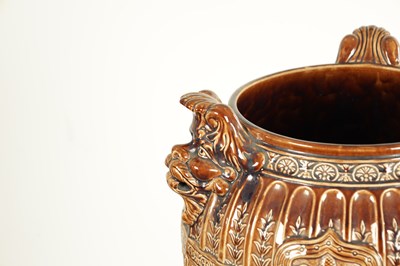 Lot 29 - A 19TH CENTURY TREACLE GLAZED MAJOLICA JARDINIERE ON STAND