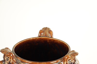 Lot 29 - A 19TH CENTURY TREACLE GLAZED MAJOLICA JARDINIERE ON STAND