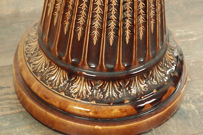 Lot 29 - A 19TH CENTURY TREACLE GLAZED MAJOLICA JARDINIERE ON STAND