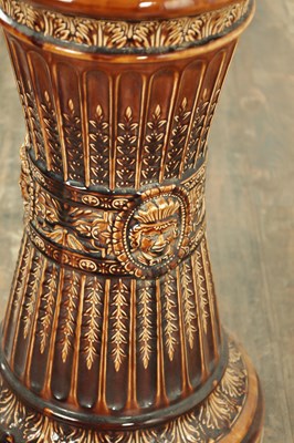 Lot 29 - A 19TH CENTURY TREACLE GLAZED MAJOLICA JARDINIERE ON STAND