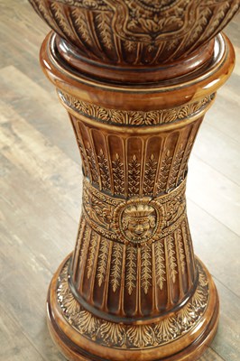 Lot 29 - A 19TH CENTURY TREACLE GLAZED MAJOLICA JARDINIERE ON STAND