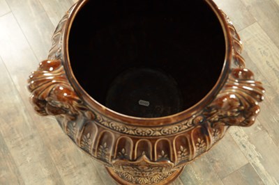 Lot 29 - A 19TH CENTURY TREACLE GLAZED MAJOLICA JARDINIERE ON STAND