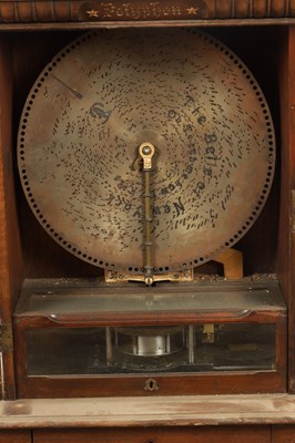 Lot 1024 - A LATE 19TH CENTURY “PENNY IN THE SLOT” UPRIGHT POLYPHON