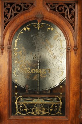 Lot 1035 - A RARE AND LARGE LATE 19TH CENTURY OAK CASED KOMET PENNY IN THE SLOT FLOOR STANDING POLYPHON TYPE MUSIC BOX