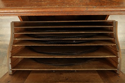 Lot 1035 - A RARE AND LARGE LATE 19TH CENTURY OAK CASED KOMET PENNY IN THE SLOT FLOOR STANDING POLYPHON TYPE MUSIC BOX