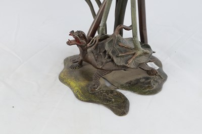 Lot 780 - AN UNUSUAL COLD PAINTED BRONZE OIL LAMP