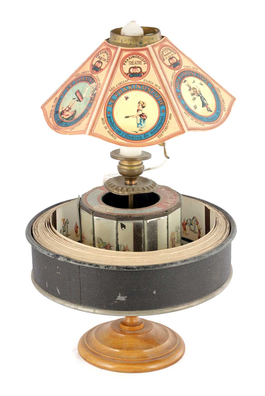 Lot 1004 - A LATE 19TH CENTURY FRENCH PRAXINOSCOPE OPTICAL TOY