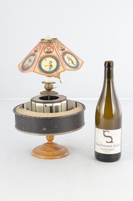 Lot 1004 - A LATE 19TH CENTURY FRENCH PRAXINOSCOPE OPTICAL TOY